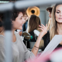 Actress at the movie backstage memorazing her role with assistant